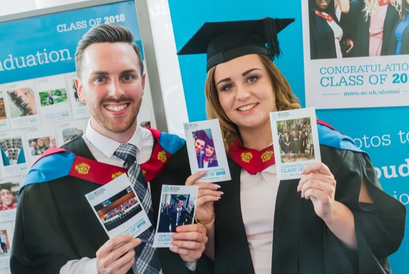 MMU graduates holding their SquareShare prints